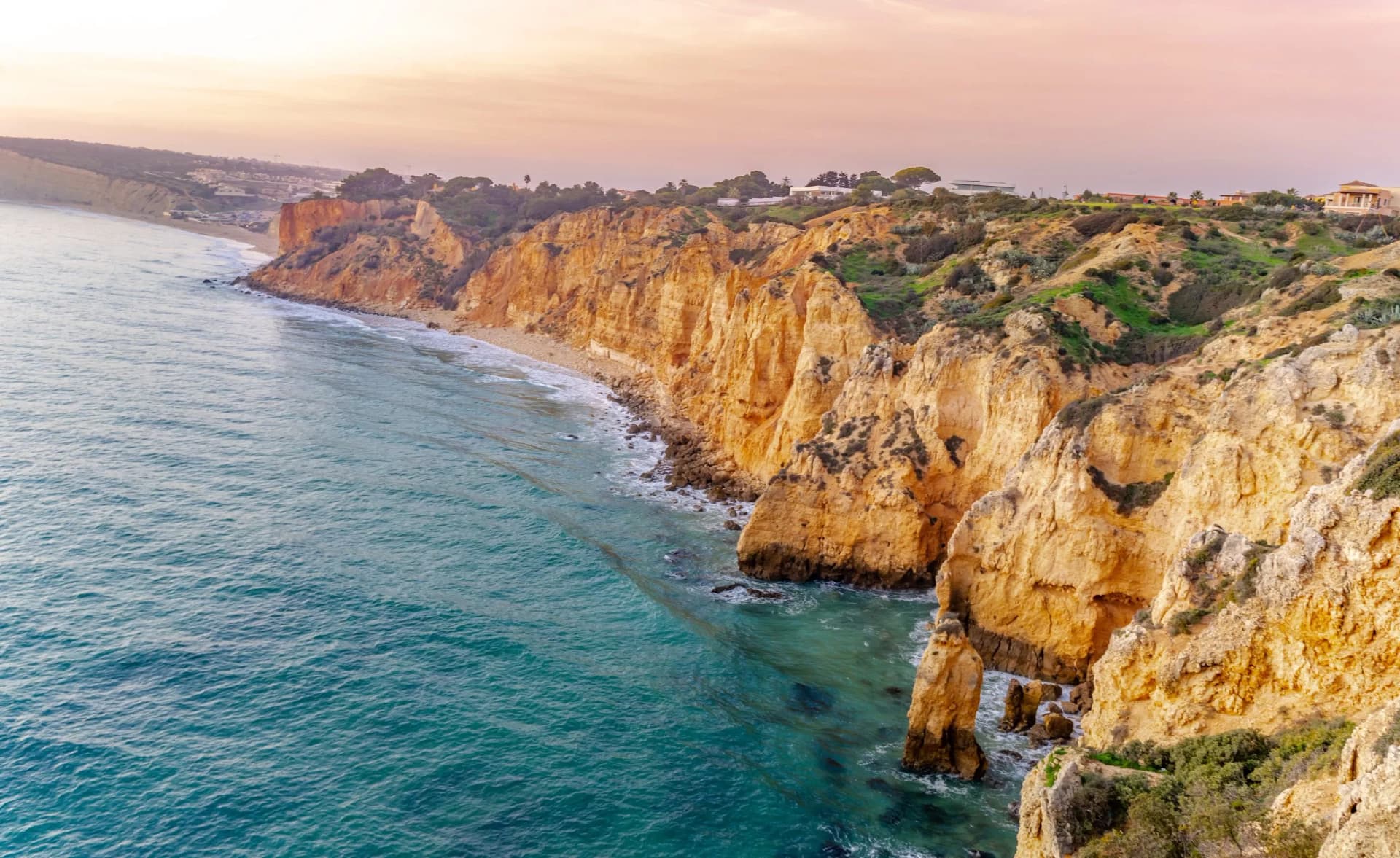 Praia da Bordeira and boardwalks forming part of the trail of tides or Pontal da Carrapateira walk in Portugal. Amazing view of the Praia da Bordeira in portuguese. Bordeira, Algarve, Portugal.