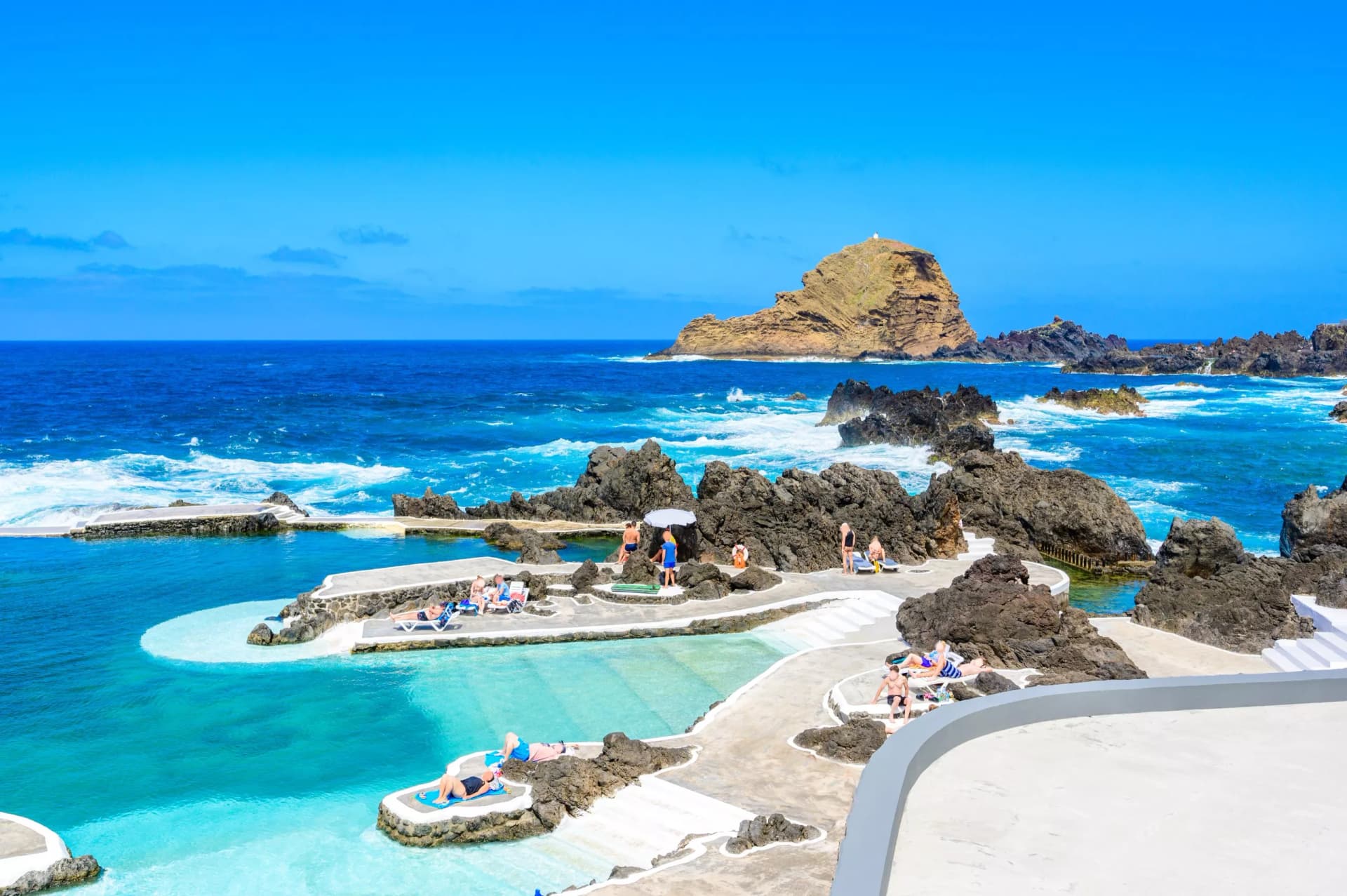 Natural volcanic swimming lagoon pools at Porto Moniz, travel destination for vacation, Madeira island, Portugal