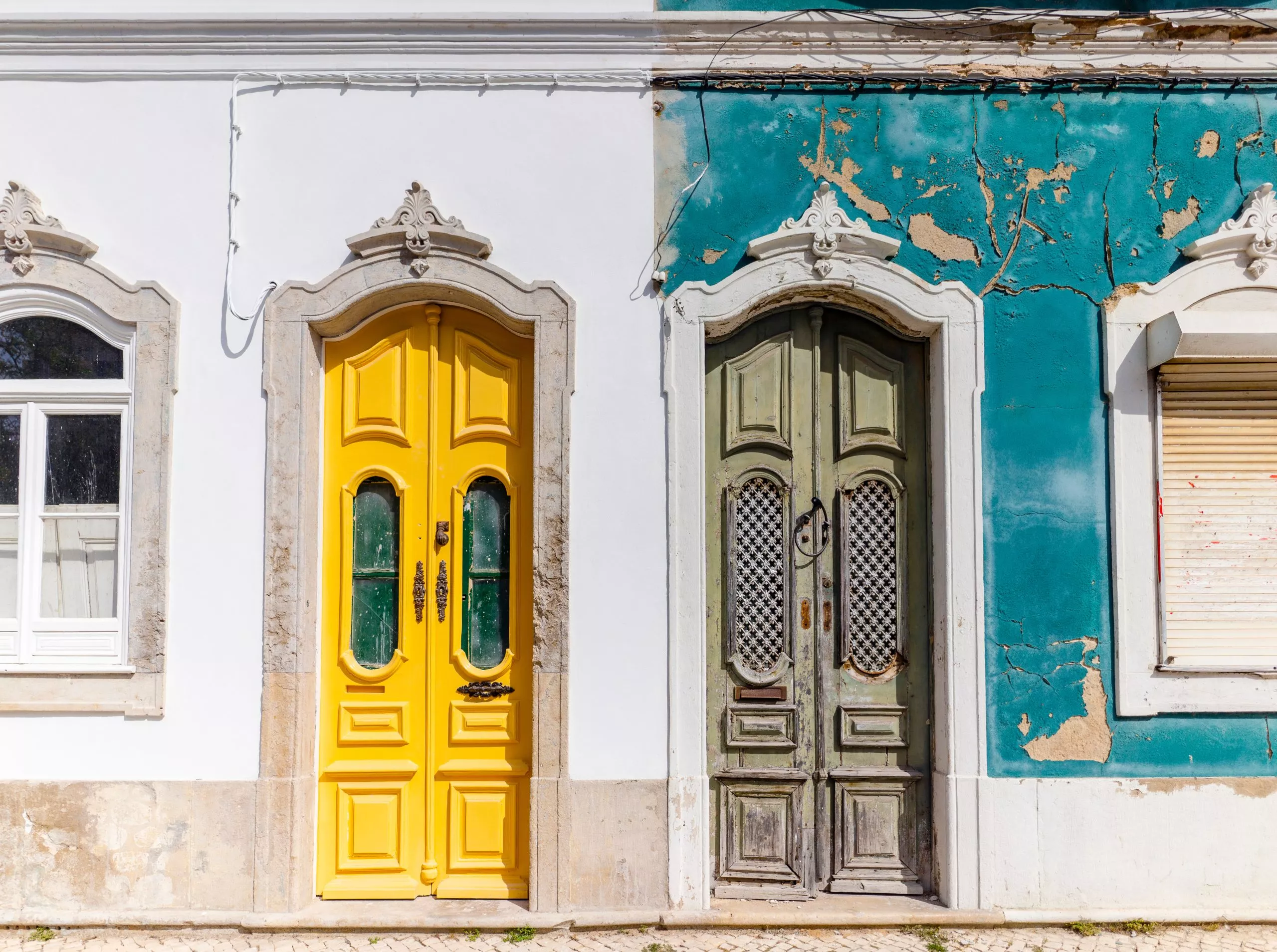 Doors to two different traditional houses in Olhao, Algarve, Portugal